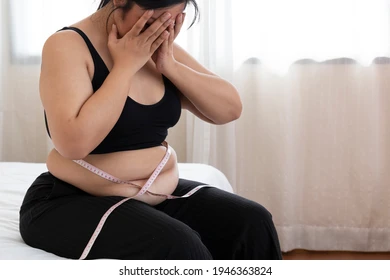 overweight-women-stressing-over-fat-260nw-1946363824.jpg