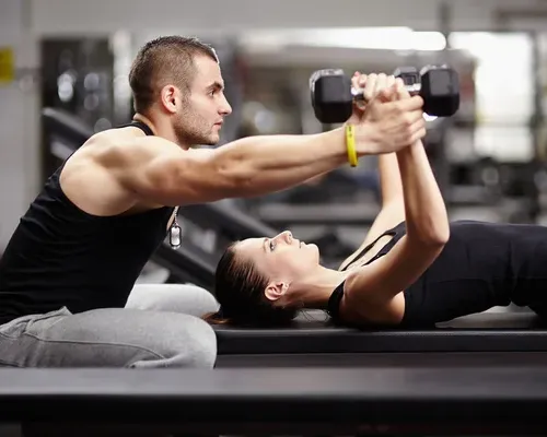 depositphotos_37800009-stock-photo-personal-trainer-helping-woman-at-4