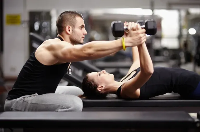 depositphotos_37800009-stock-photo-personal-trainer-helping-woman-at-4